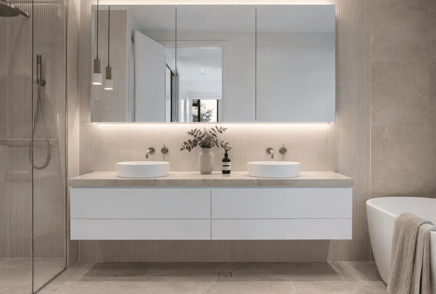 Custom bathroom vanity Geelong - custom wall-hung cabinetry and stone benchtop by Fitted Geelong